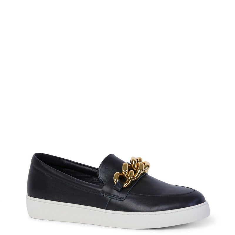Black loafer with gold link chain detailing on the lip on the shoe.